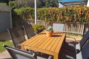 The rear deck of our Cooks Hill Cottage provides an outdoor dining setting, additional seating and BBQ.