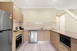 The Kitchen of a 2 Bedroom Townhouse Apartment at Birmingham Gardens Townhouses.